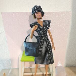 Elegant Black Polka Dot Cotton doll Dress and Genuine Leather Shoulder Bag.
